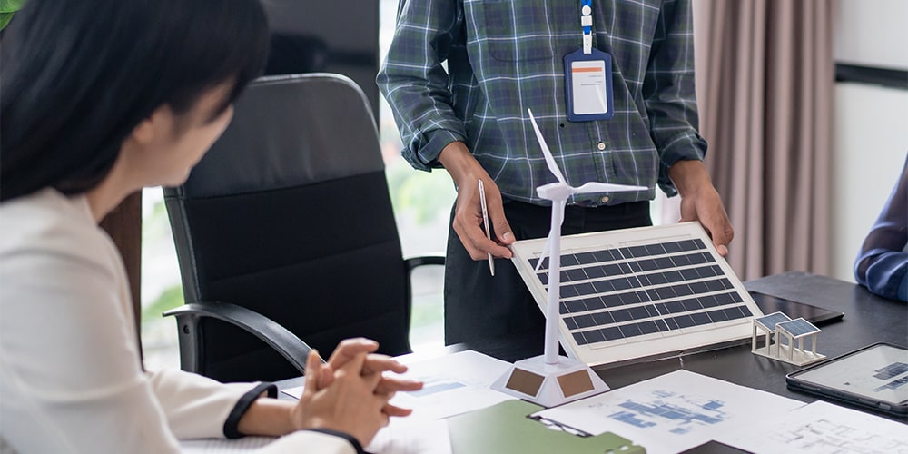 Digital Management Systems icons overlaid over somebody working on a table