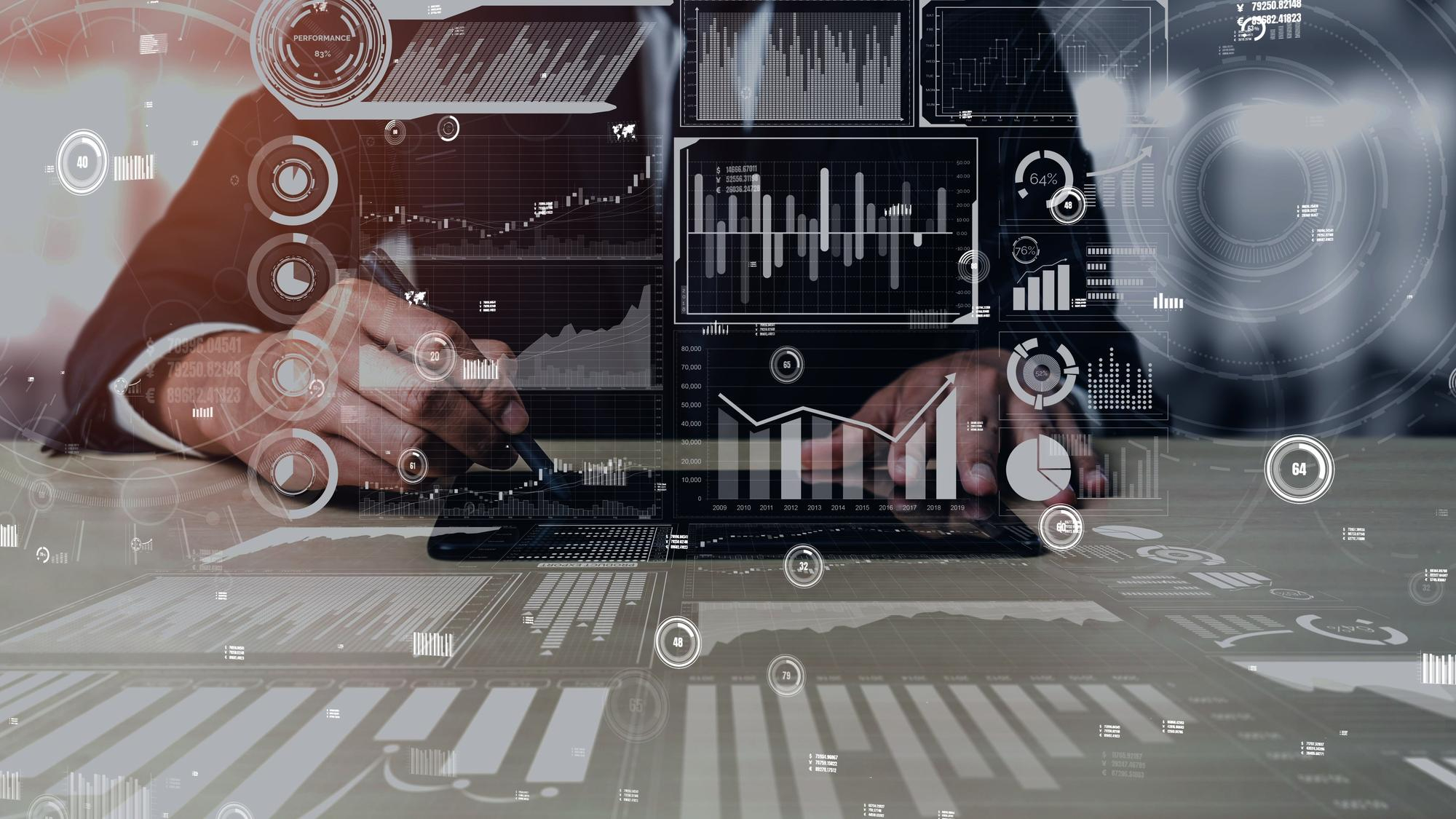 Digital Management Systems icons overlaid over somebody working on a table