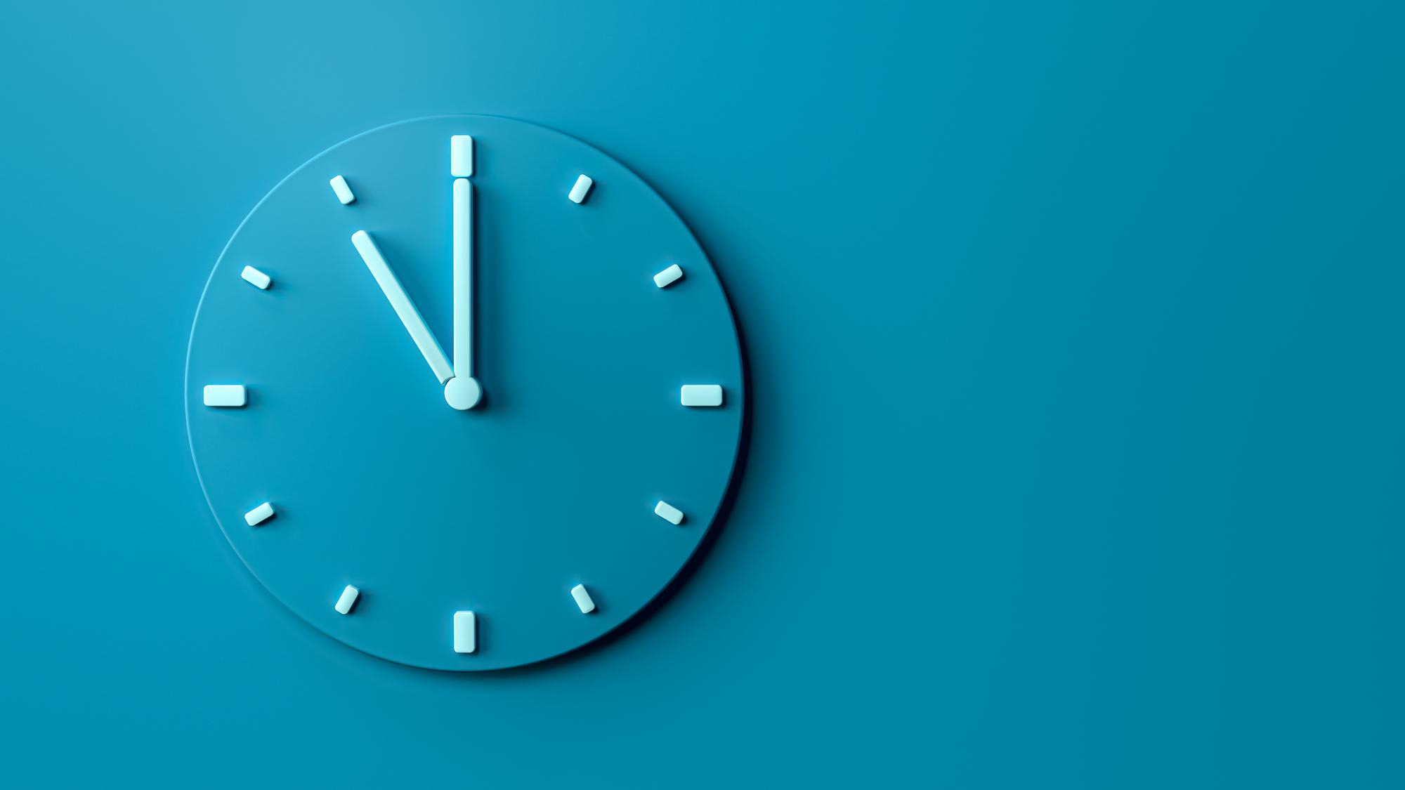 Blue clock on blue wall