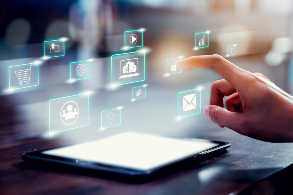 Somebody touching digital icons representing different types of technolgoy